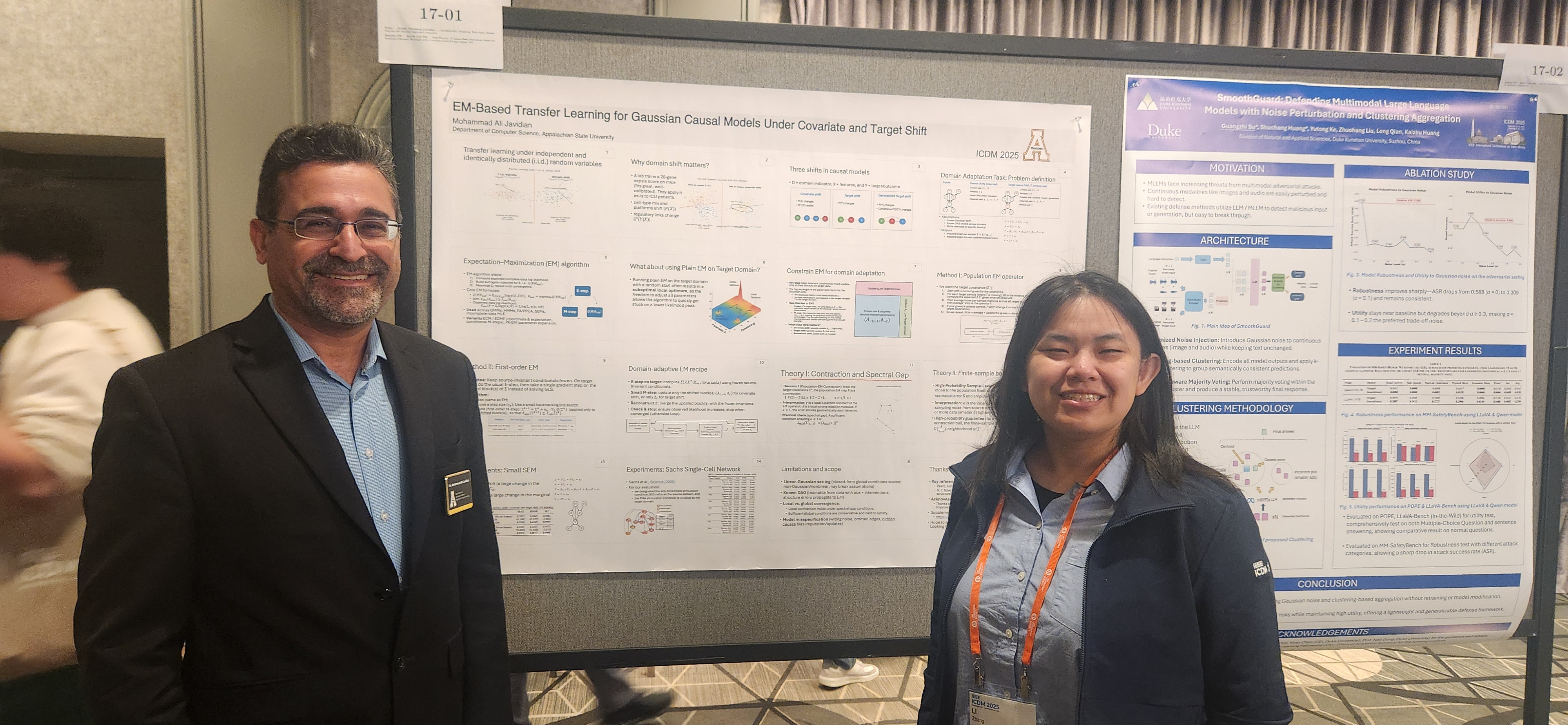 Presenter and another attendee in front of the EM-based transfer learning poster.