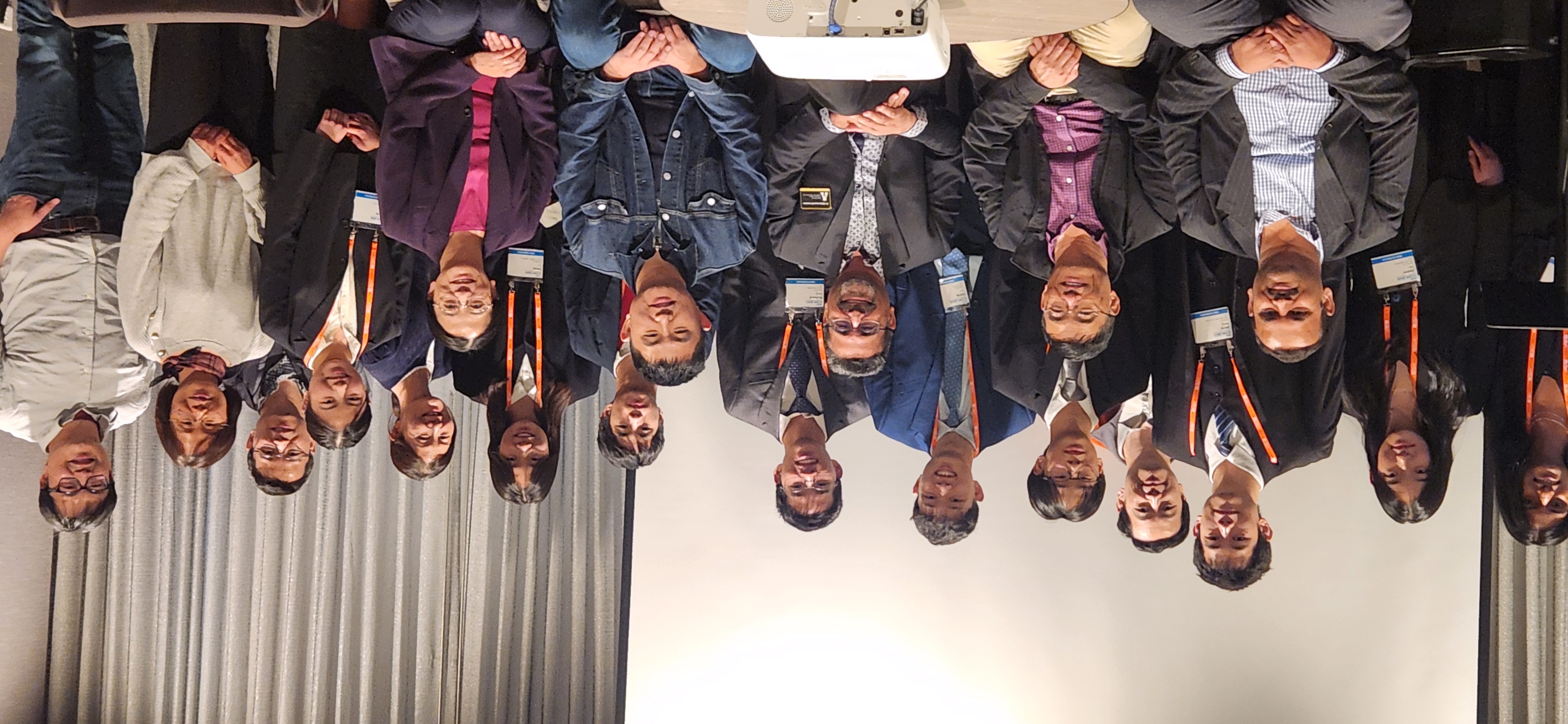 Large group photo of symposium participants and organizers.